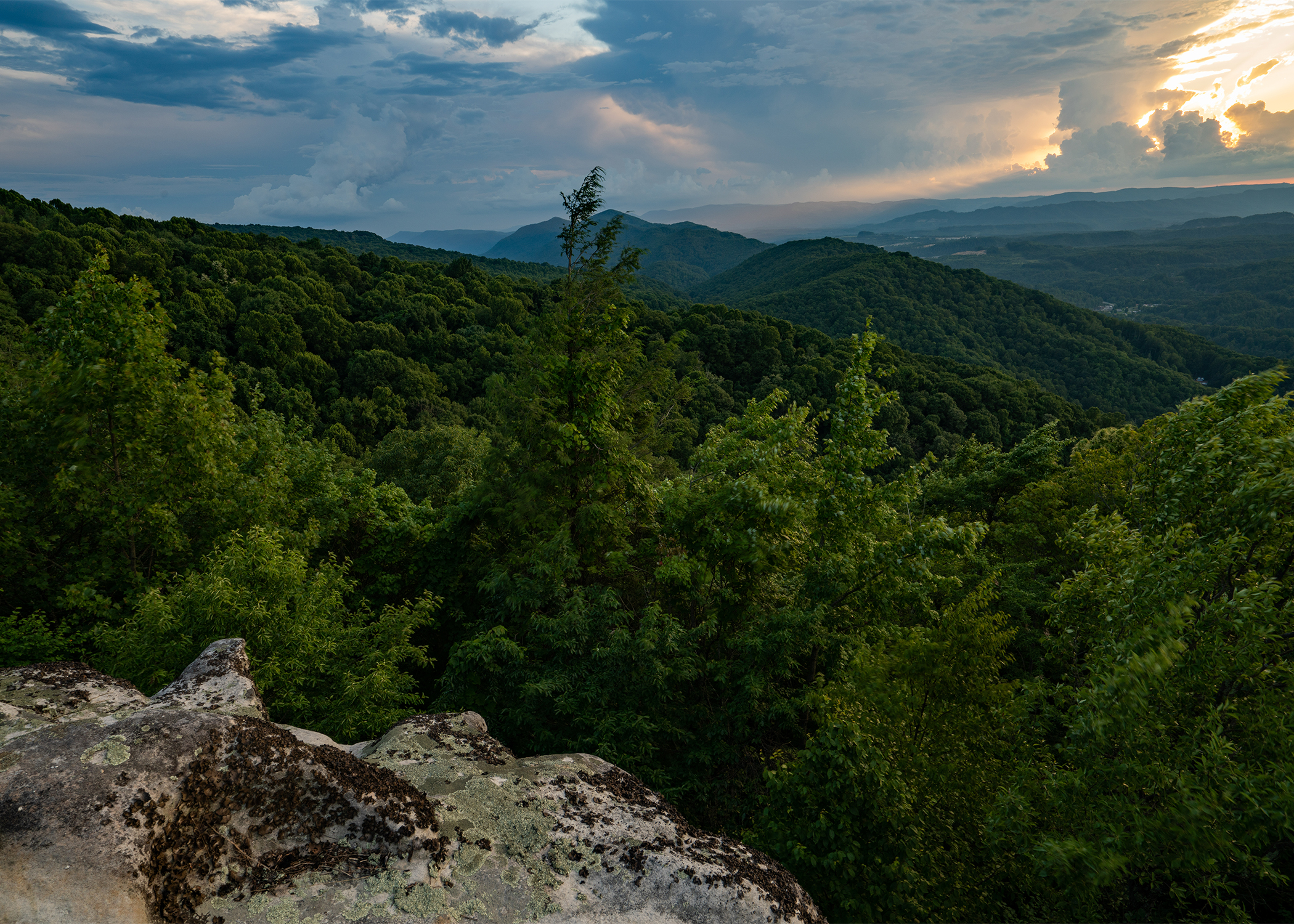 Sun setting over the Appalachian Mountains in Kentucky as seen from a bluff.
