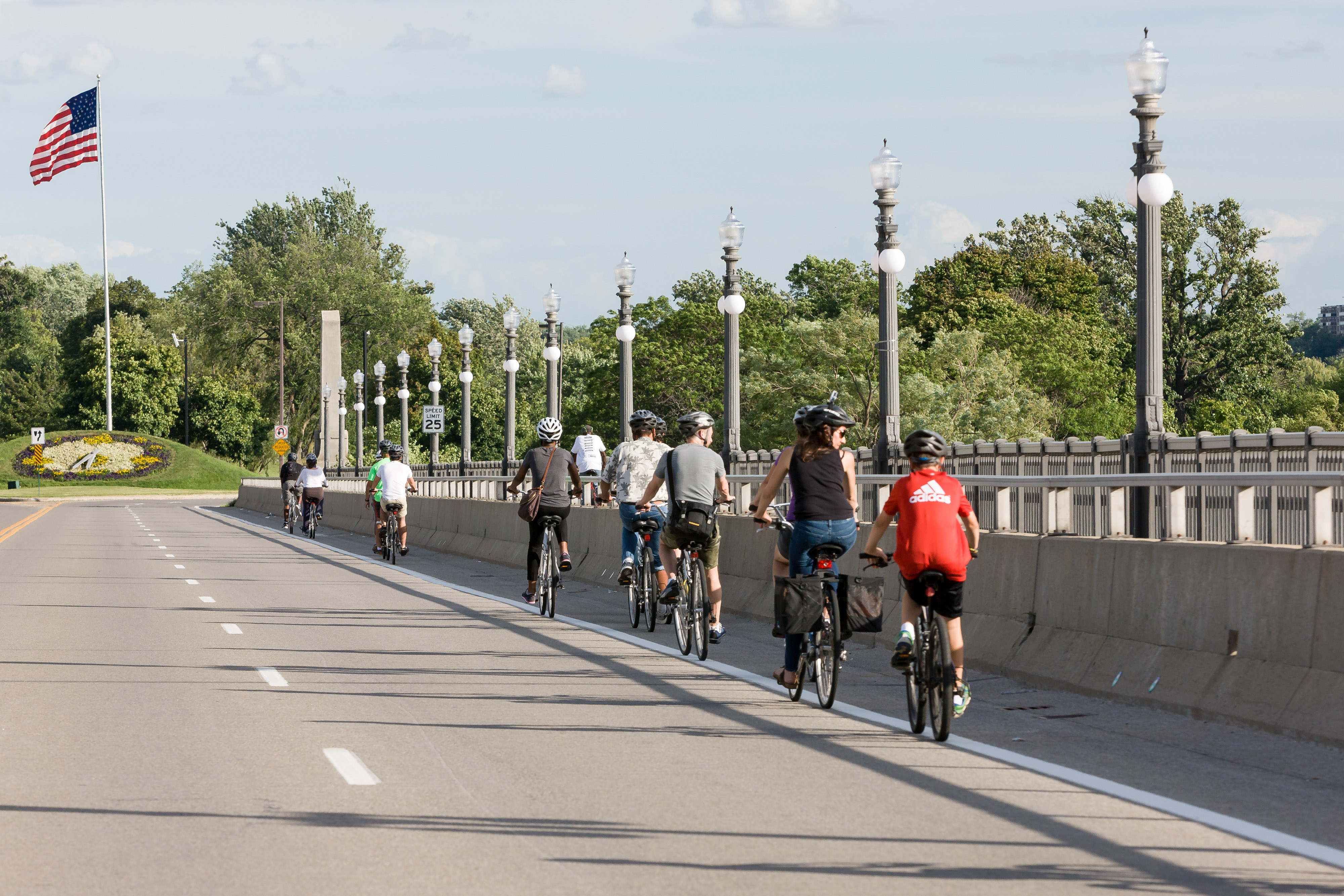 A group of bicyclists cross a bridge in Detroit, MI.