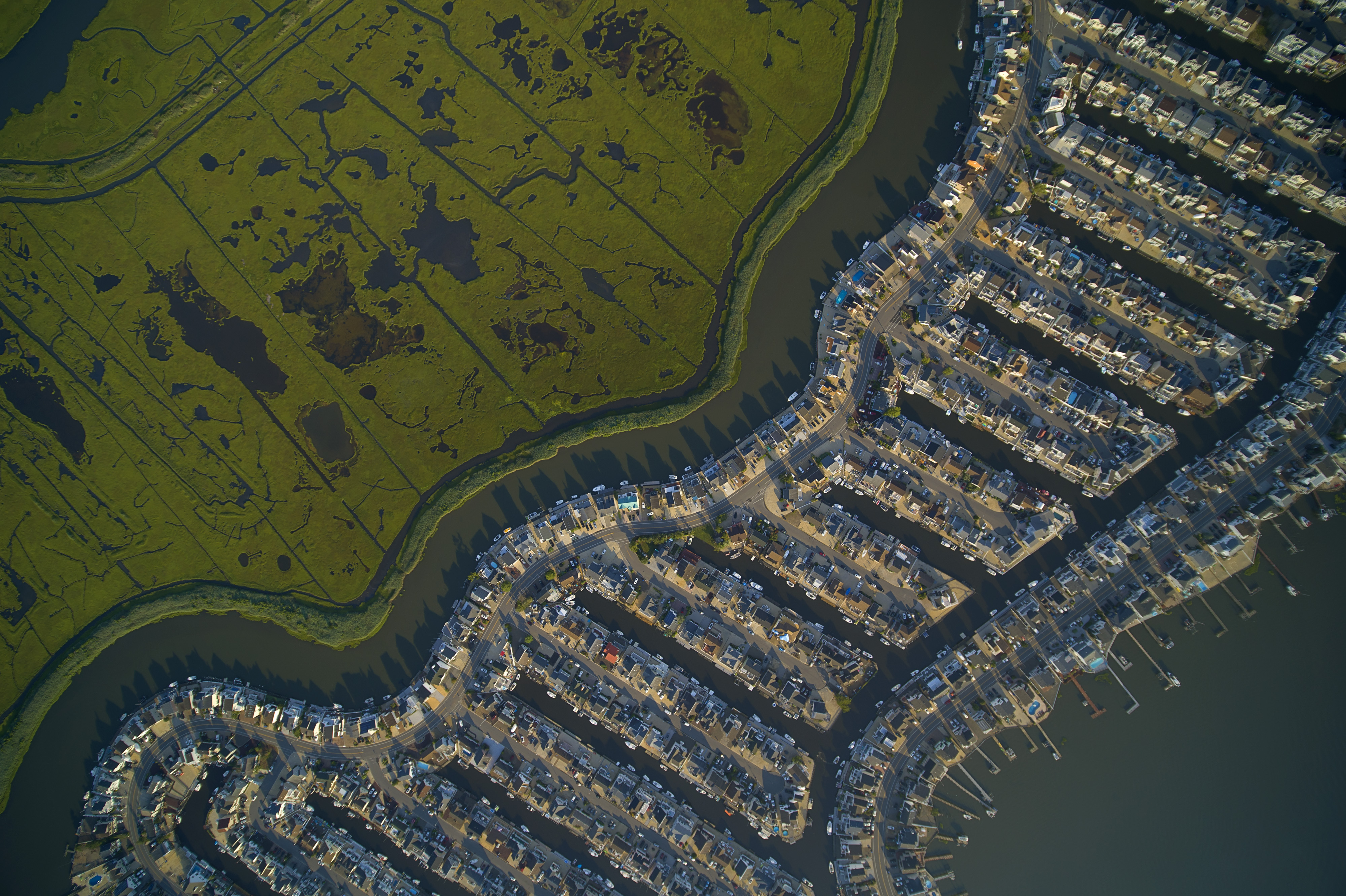 Aerial view of a coastal town surrounded by water.