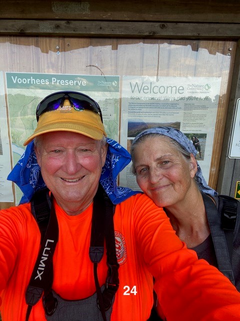 Two people smile for a photo.