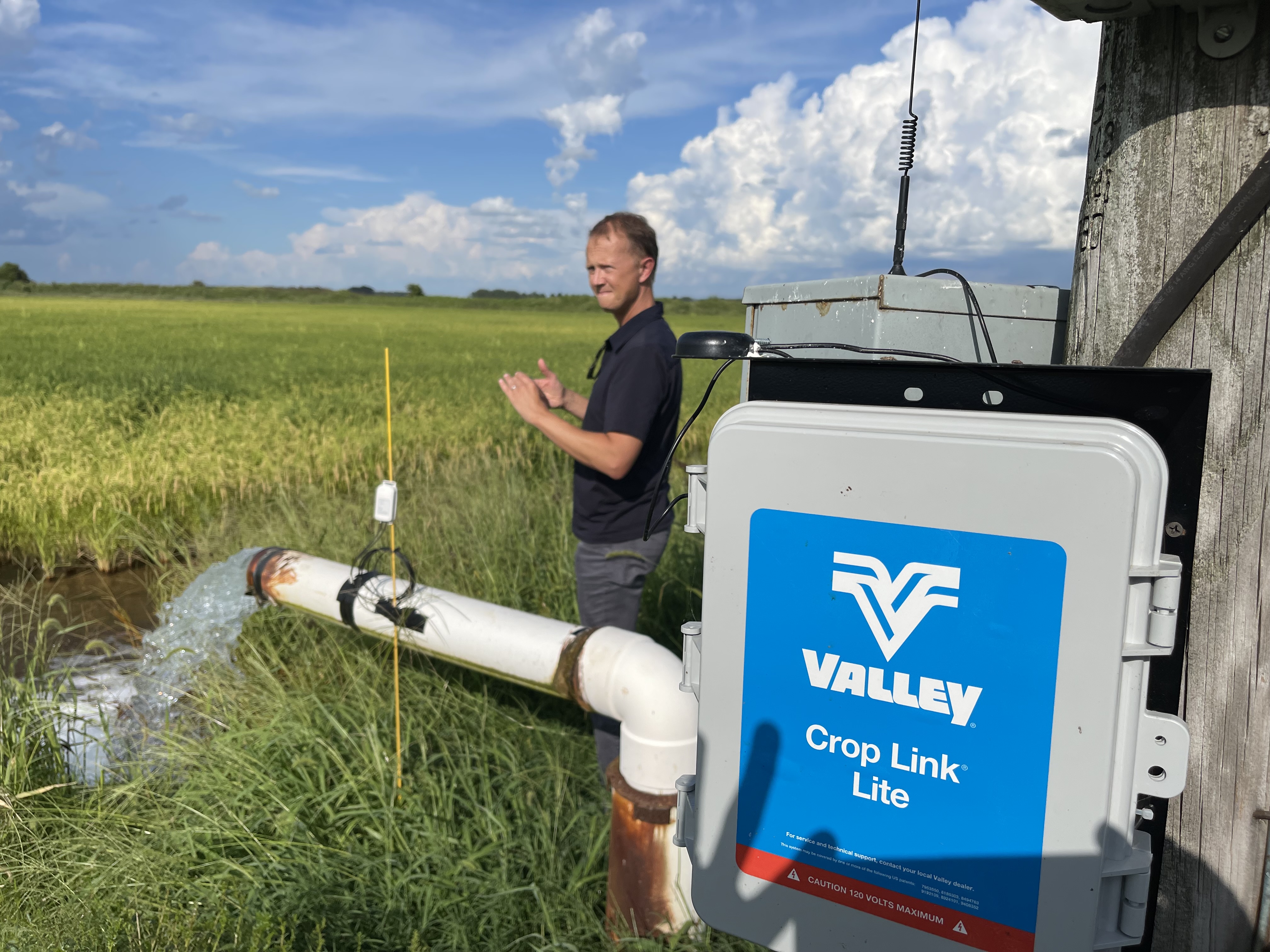Man standing next to a well timer.