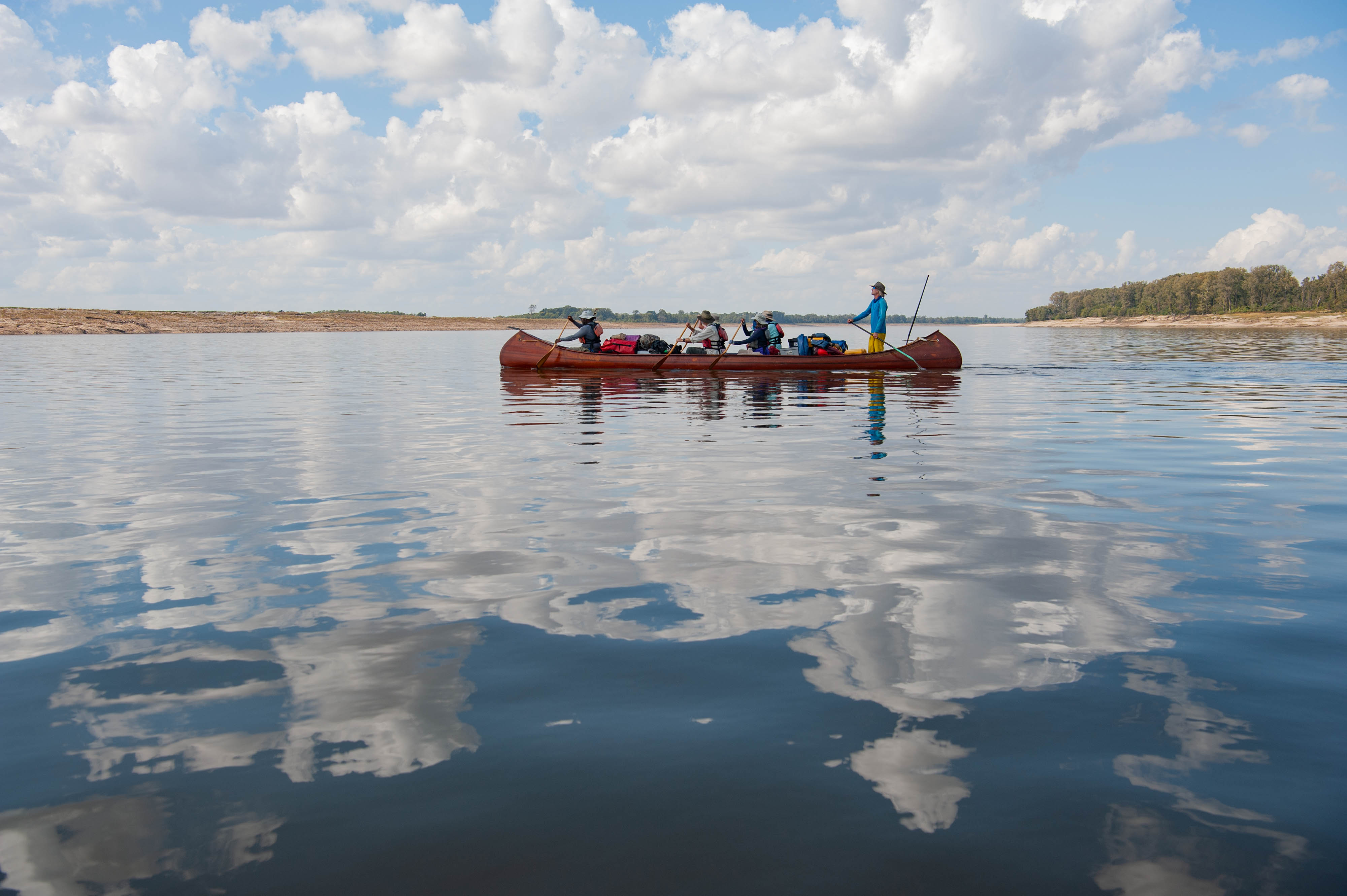 Two men canoe on the Mississippi River.