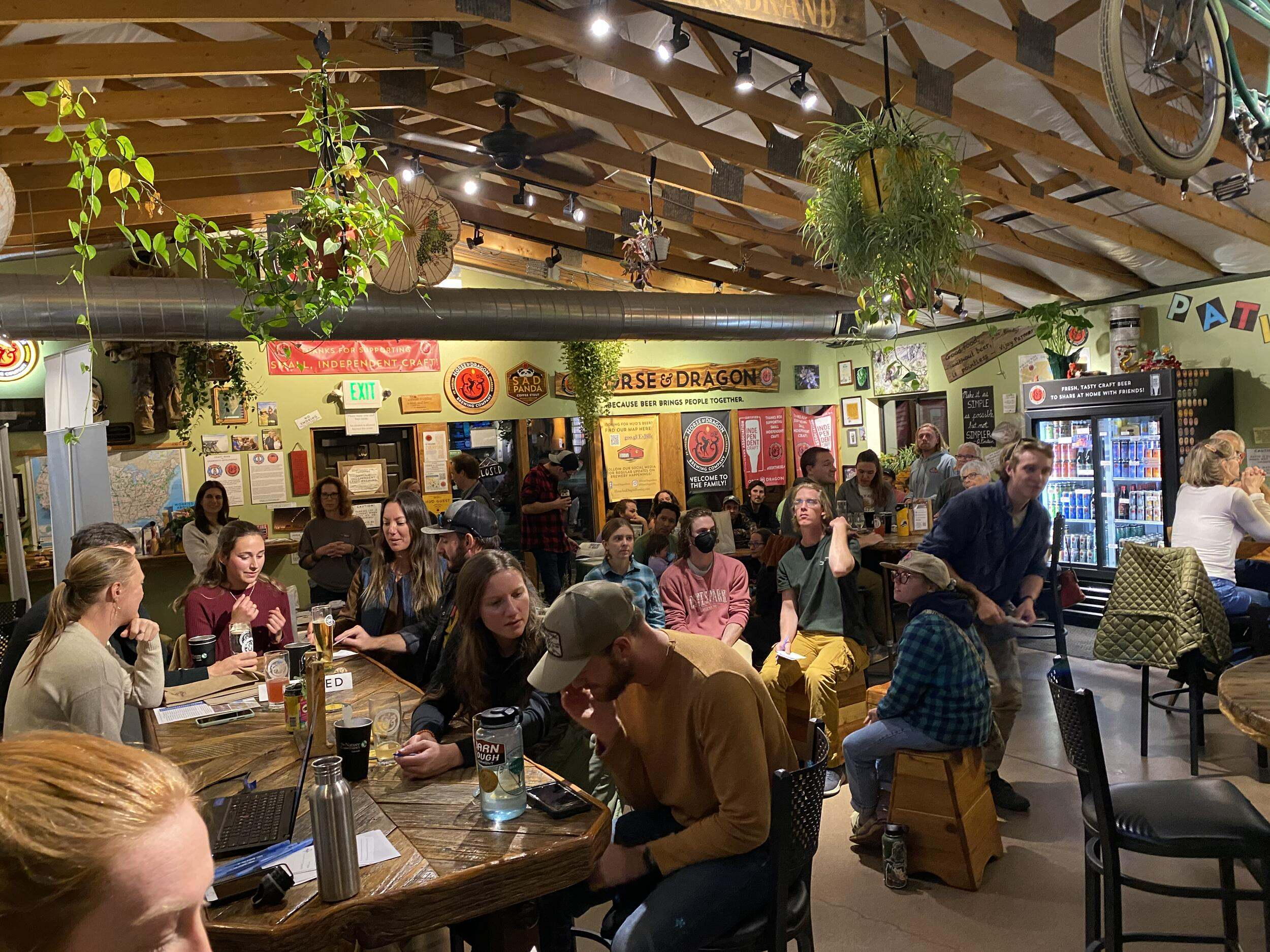 A group of people doing trivia at a brewery.