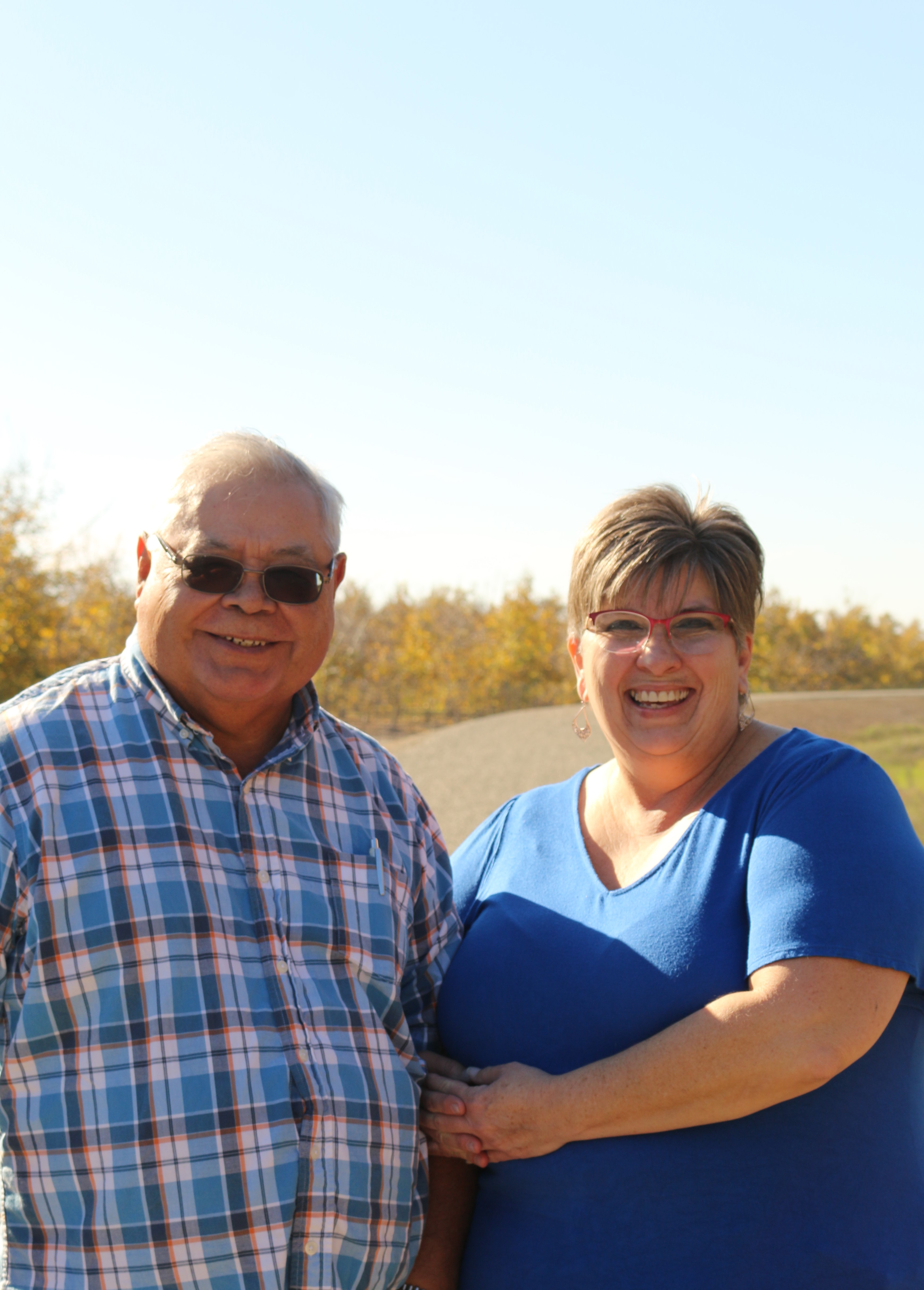 Jose Puente and Lee Ann Puente smile at the camera.