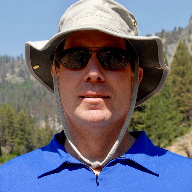 Man in sunglasses and black shirt at Follensby Pond.