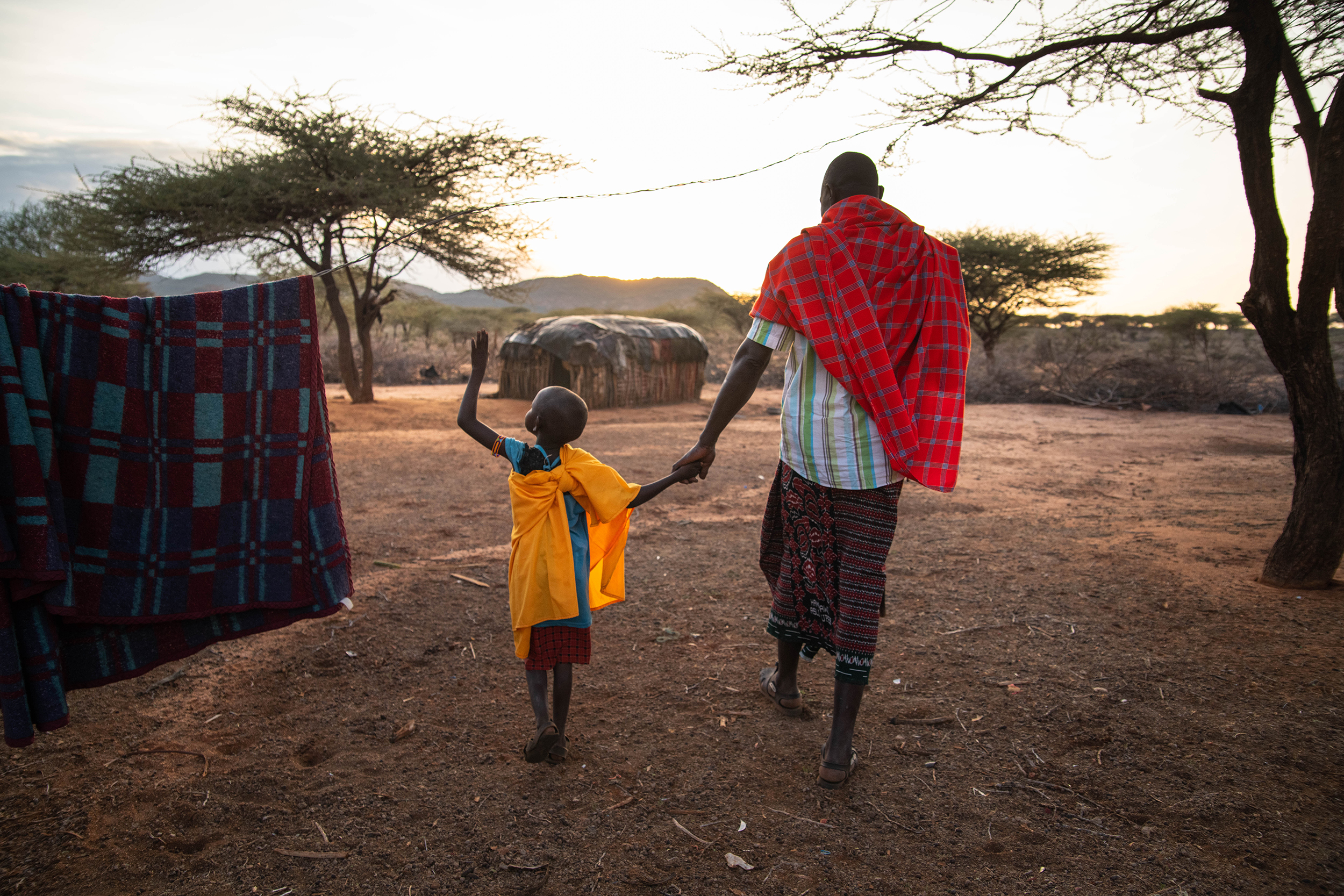 A ranger walking with his daughter