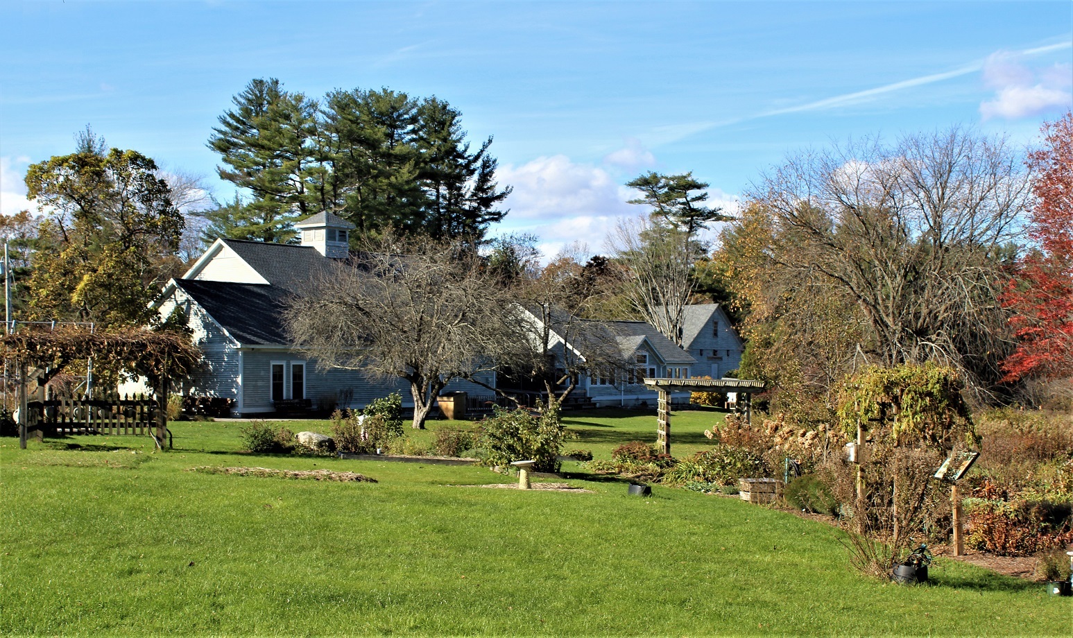 Several buildings sit next to gardens and lawns.