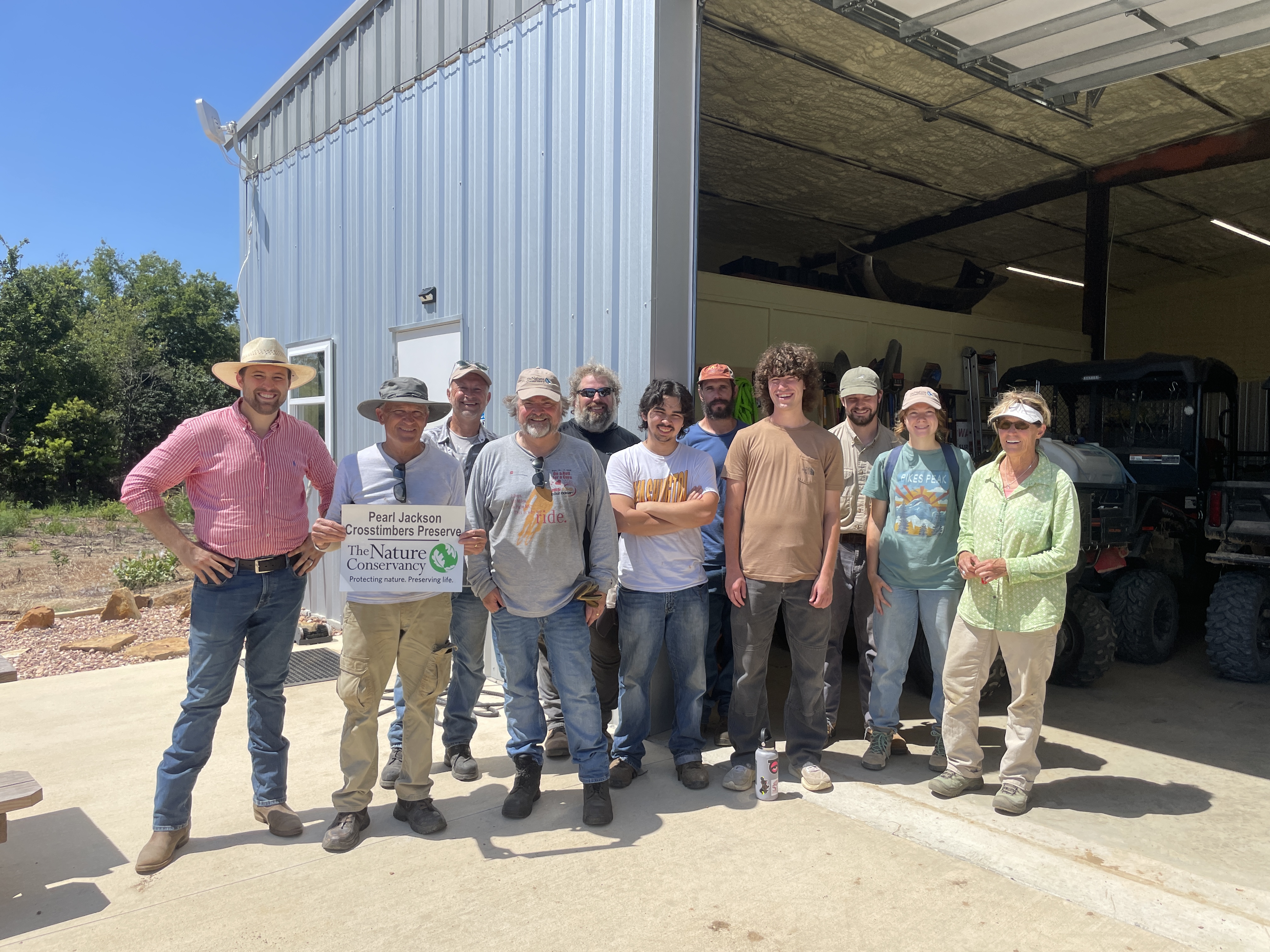 A group of Oklahoma volunteers posing for a photo after a day working on the preserve.
