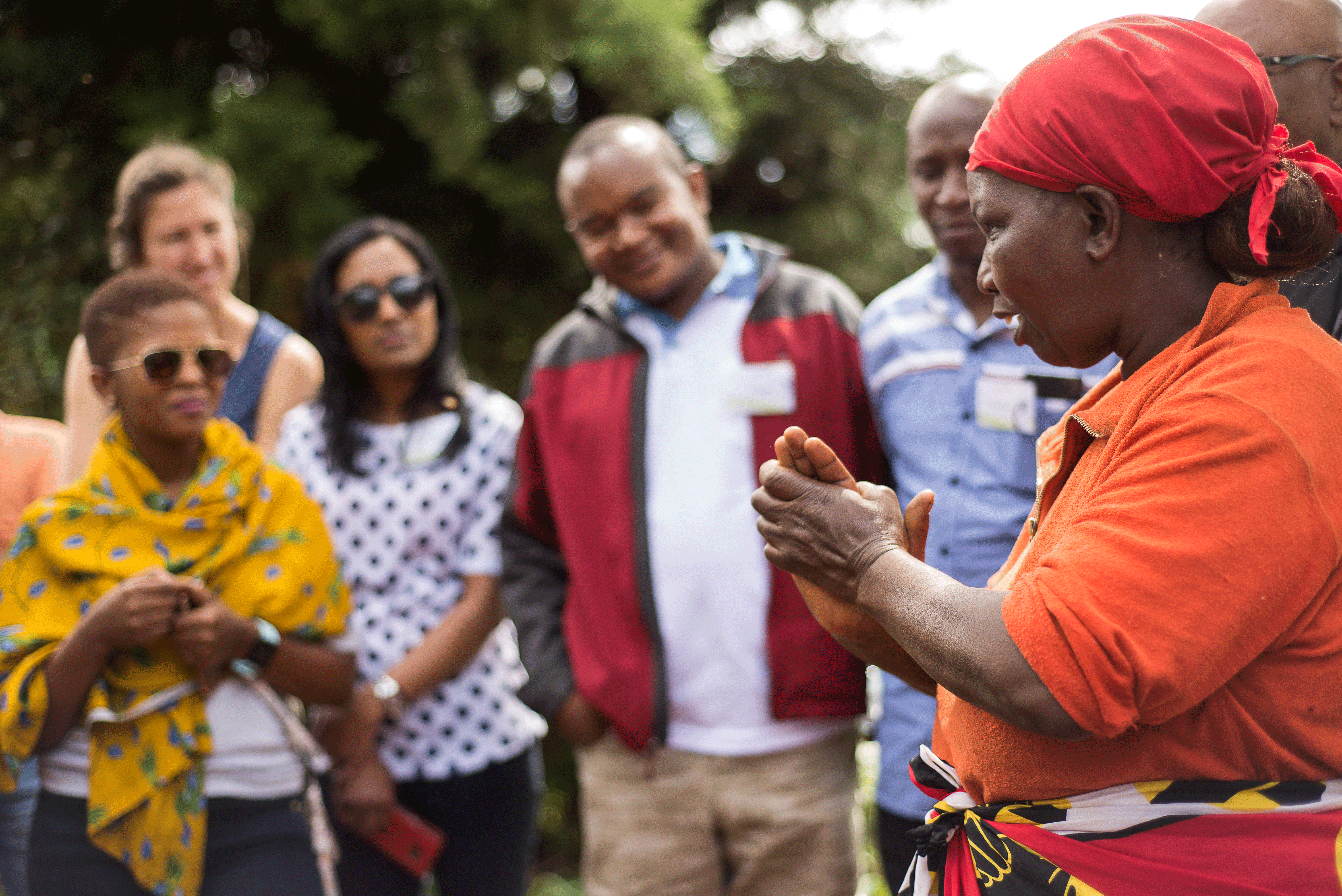 Josephine Mwangi, a coffee farmer in the Nairobi watershed,  tells visitors from the Africa Water Fund network about her efforts to achieve Rainforest Alliance Certification.