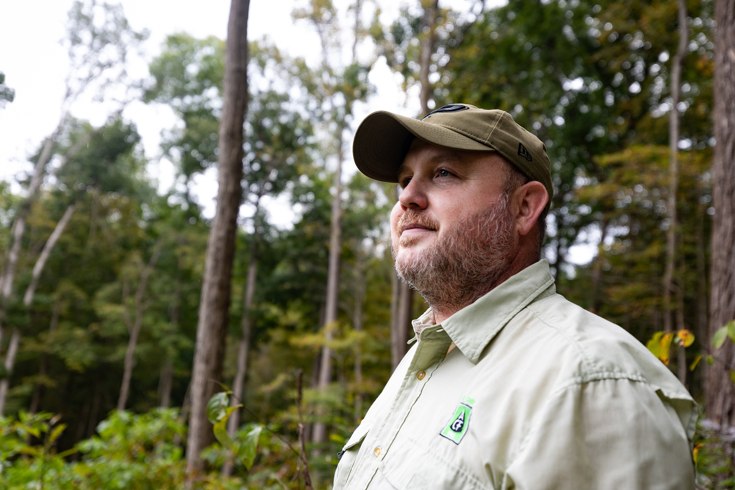 Perry Seitzinger, a forester, stands in healthy forest.