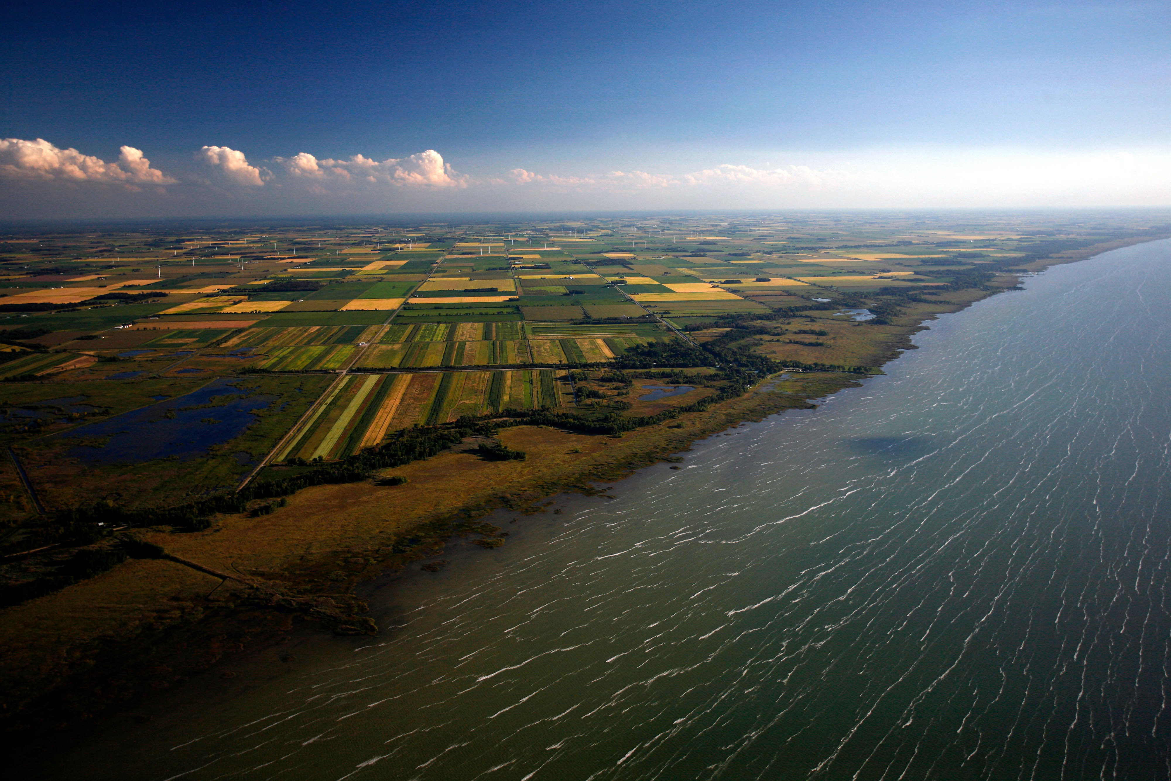 Aerial of Saginaw Bay farmland next to a river.