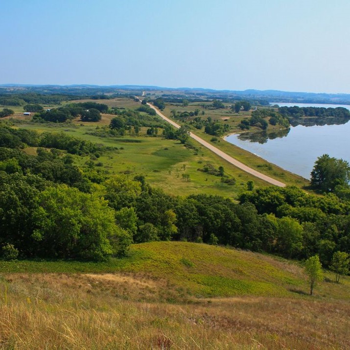 View of a prairie next to a lake.