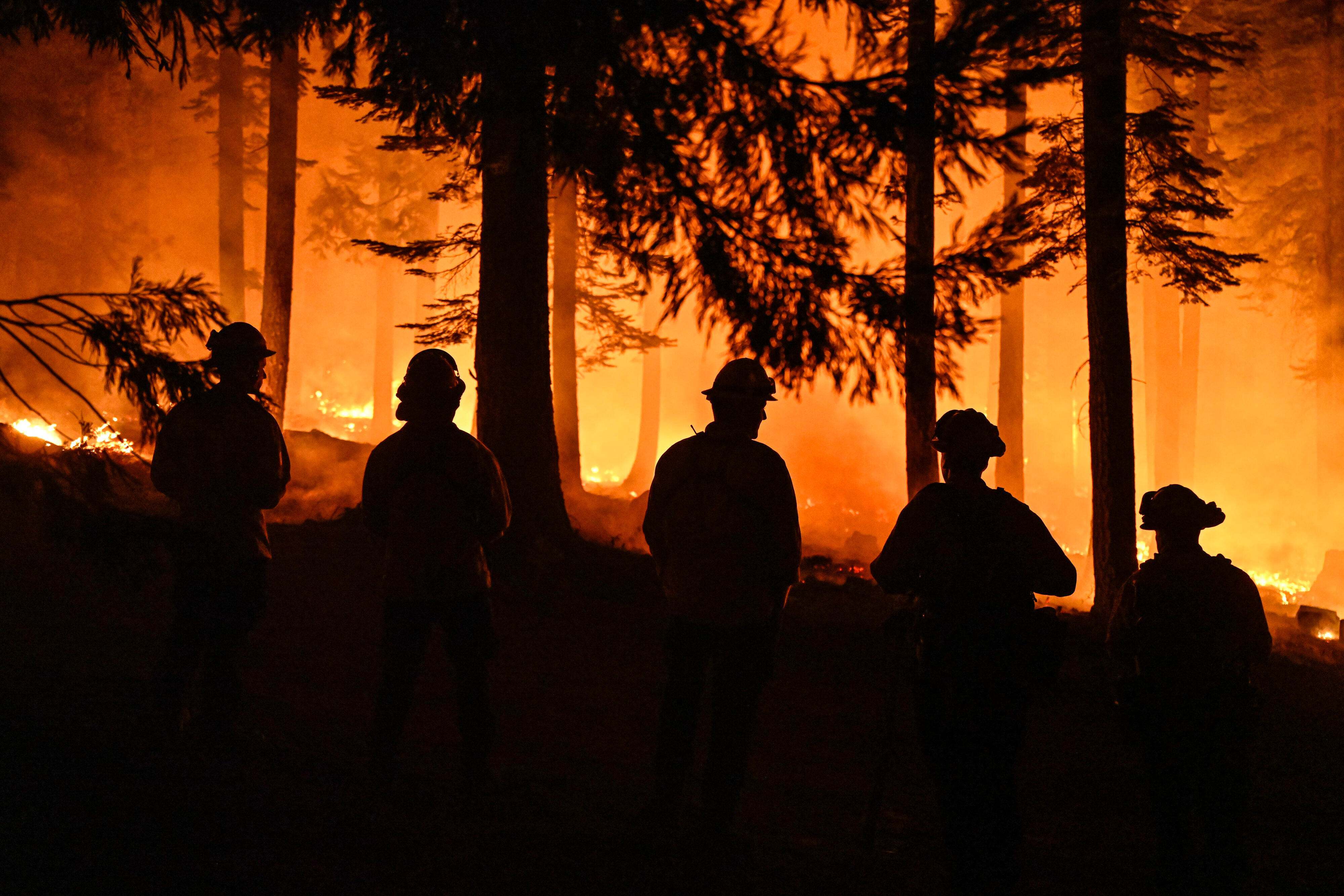 A fire crew at an operation near Butte Meadows, California, at the Dixie Fire. July, 2021.