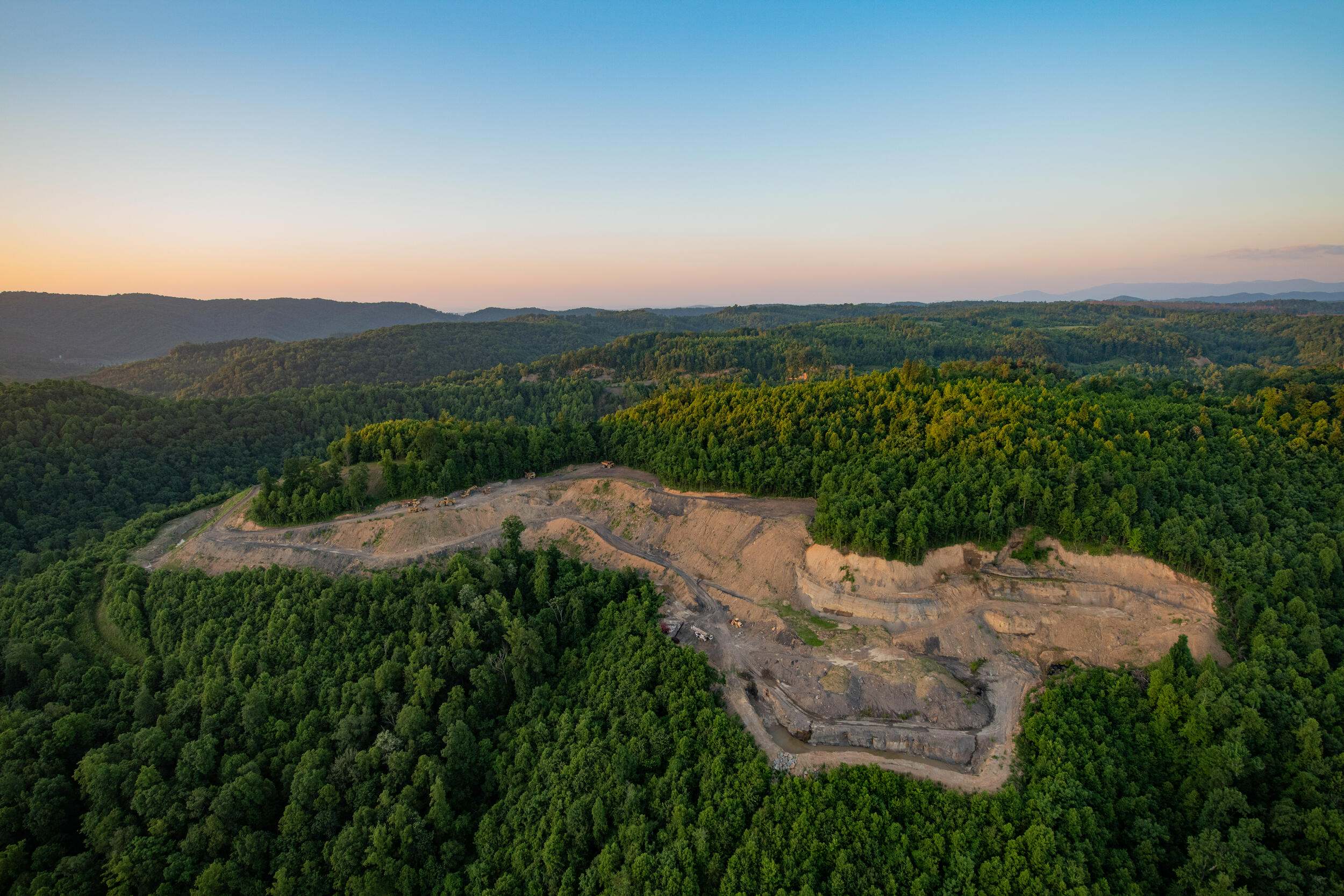 aerial view of surface coal mine in a forest