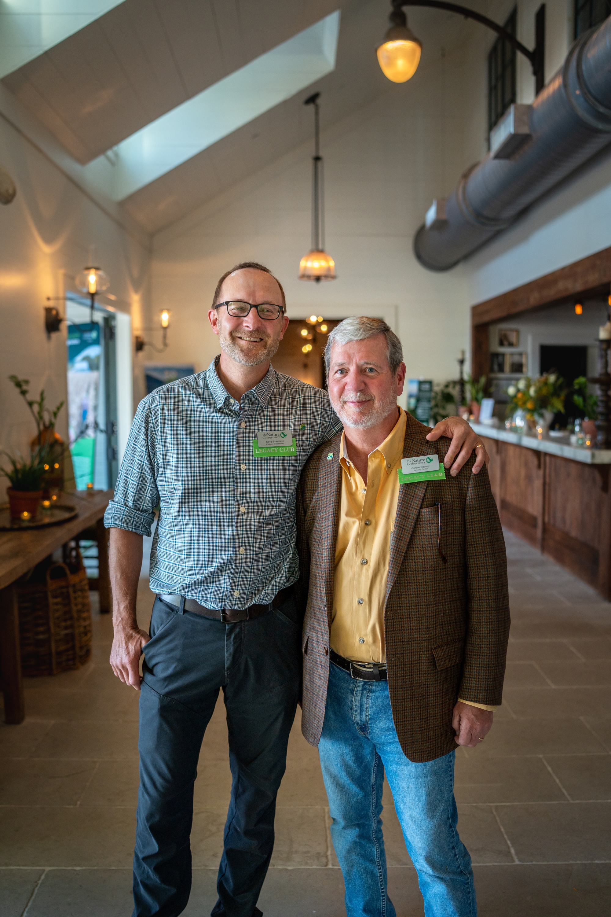 David and Gordon standing next to each other smiling at the camera.