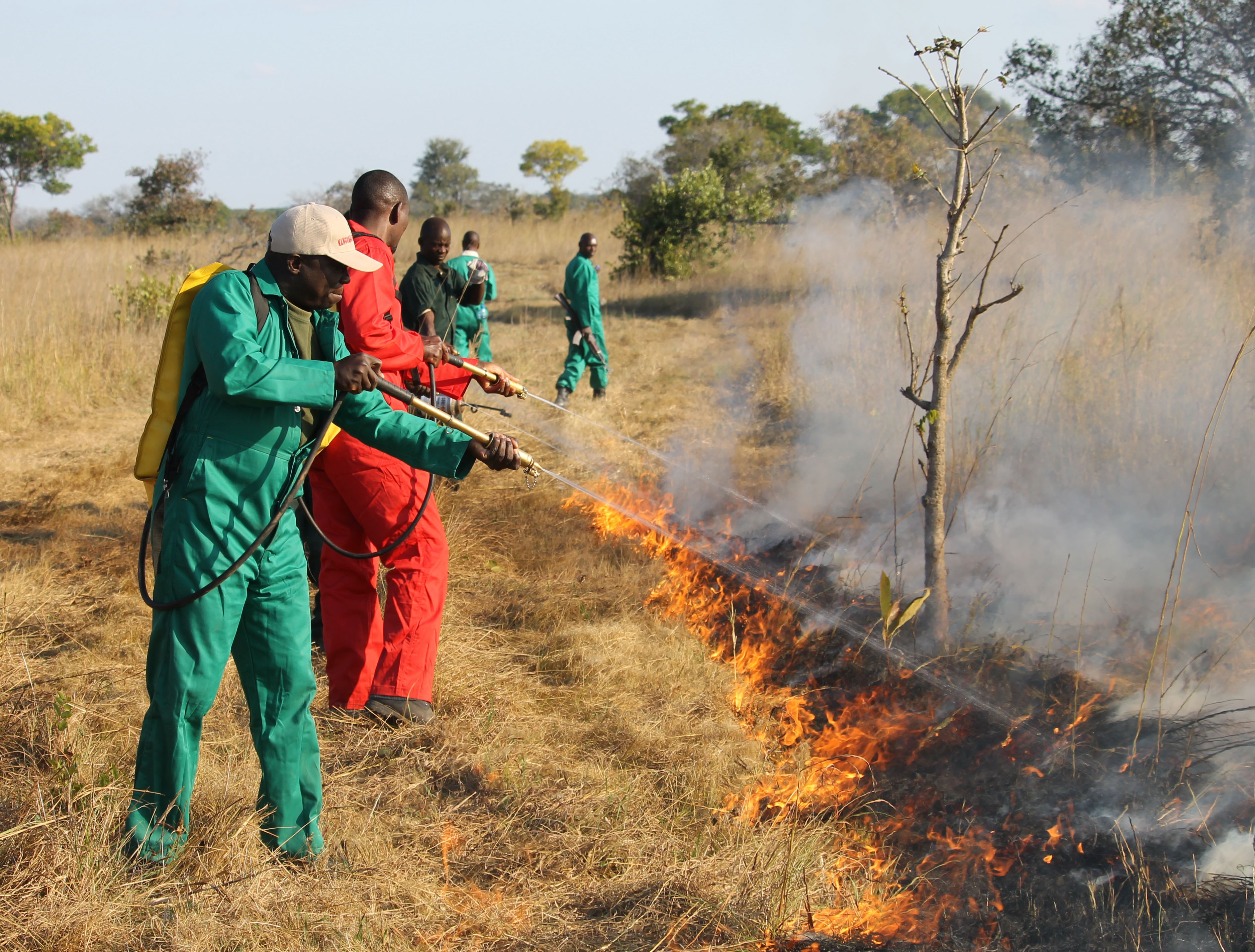 Firefighters conduct controlled burn in Zambia.