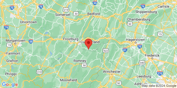 Map with marker: Hybrid road and topographical map showing an orange pointer centered on the Maryland/WV border southeast of Cumberland, MD.