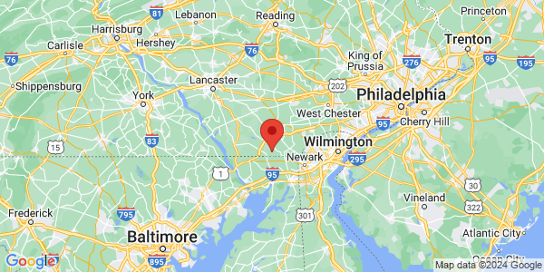 Map with marker: Hybrid road and topographical map showing a pointed centered west of Wilmington, DE.