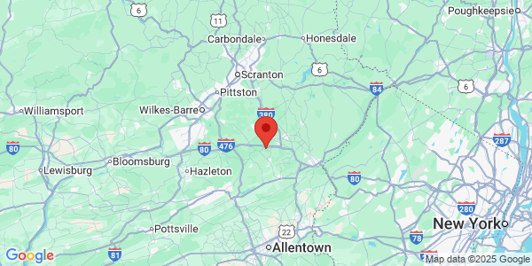 Map with marker: Hybrid road and topographic map showing an orange pointer centered south-east of Wilkes Barre, PA.